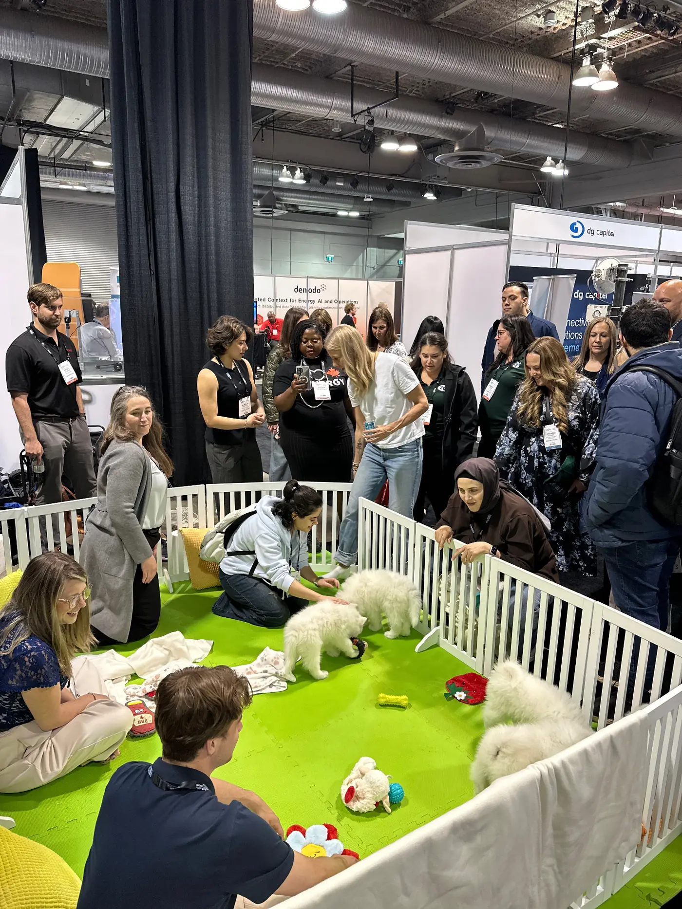 Guests gathering around the Puppy Aura lounge at a corporate event