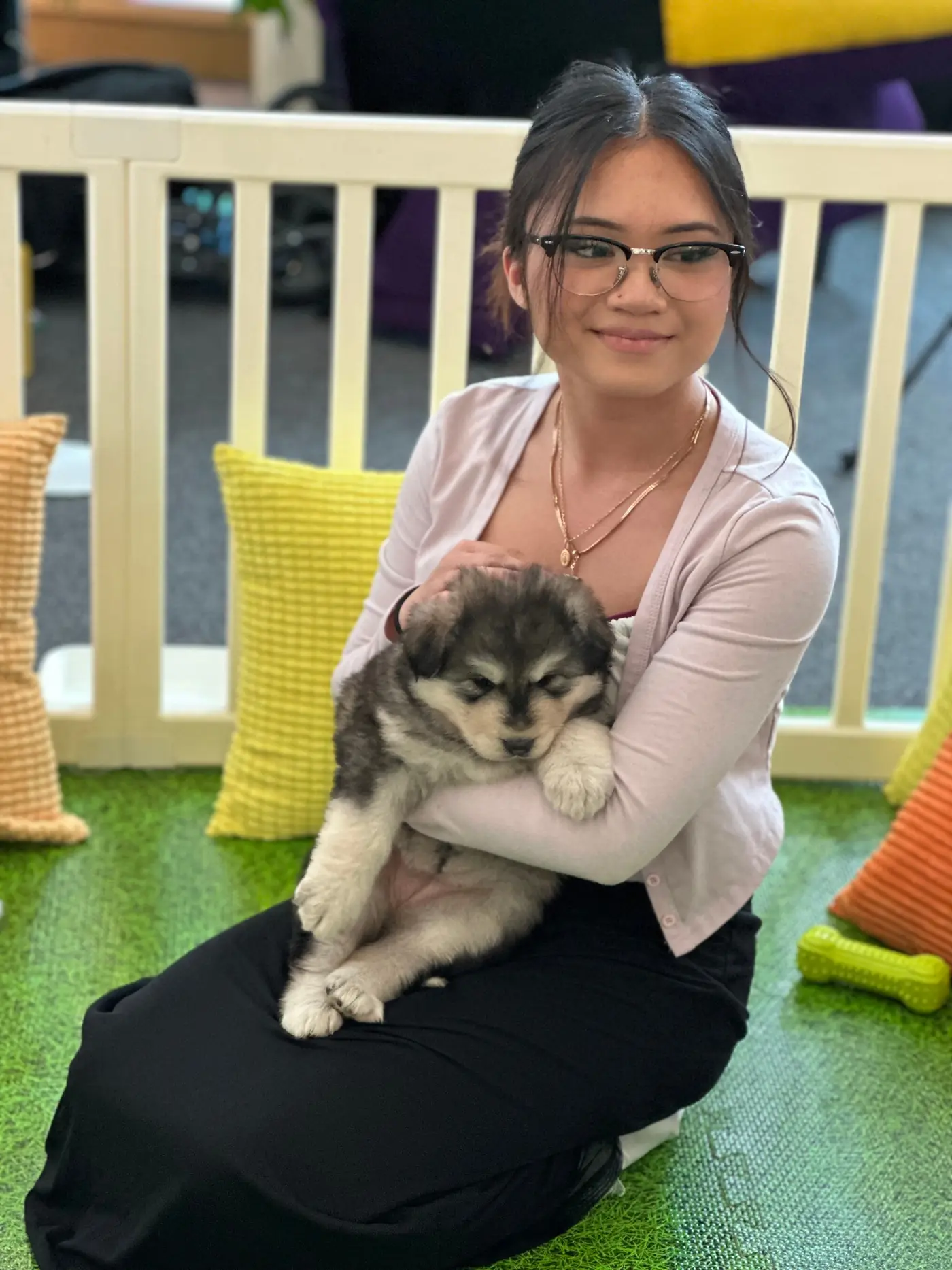 A Puppy Aura guest holding a puppy